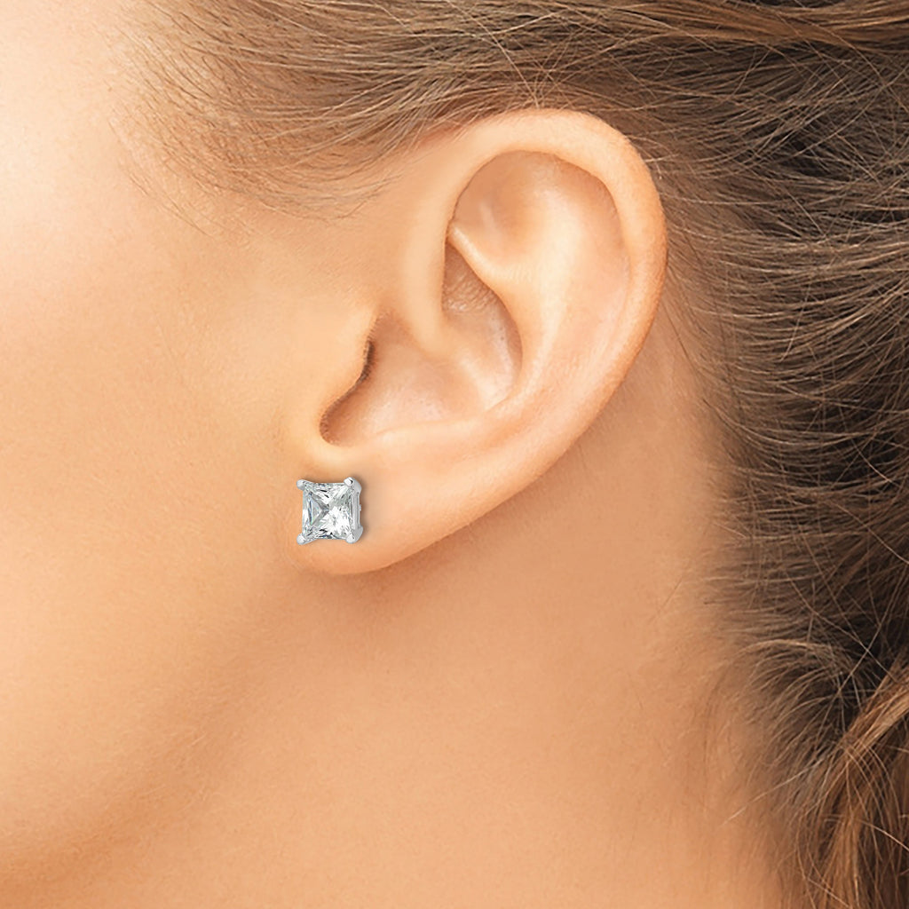 Princess-cut diamond stud earrings in white gold.