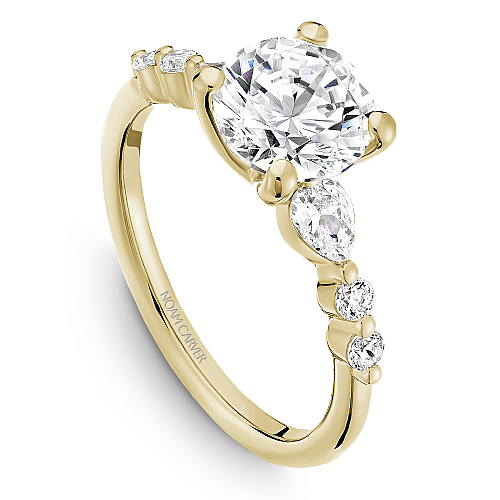 14K yellow gold ring with pear diamonds.