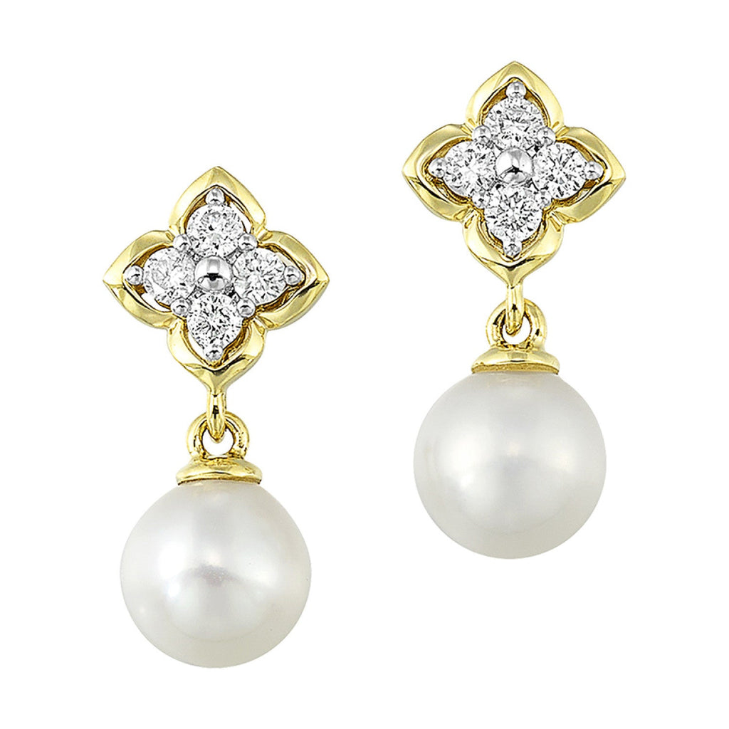 Yellow gold dangle earrings with pearls.
