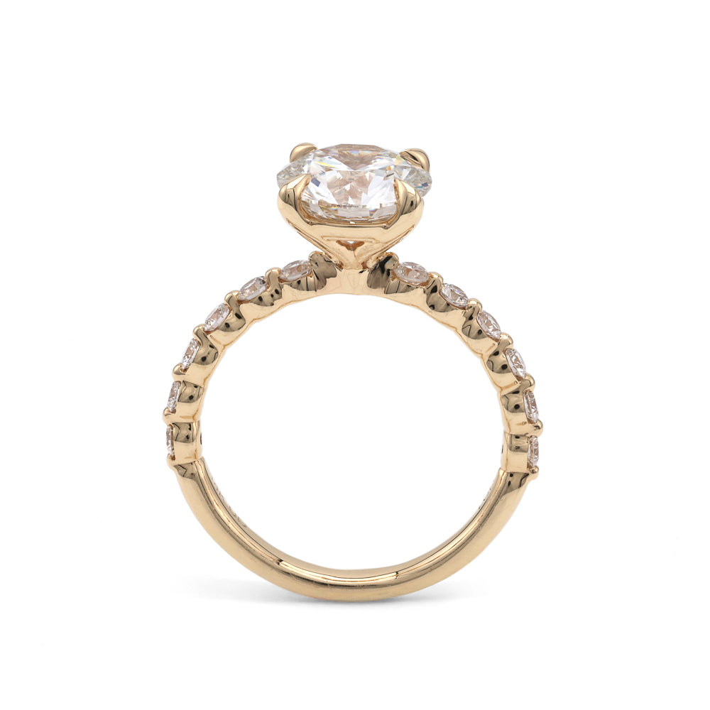 Yellow gold ring with round lab-grown diamonds.