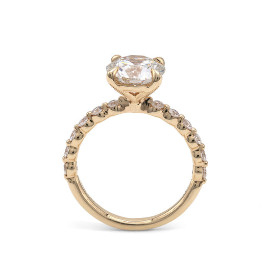 Yellow gold ring with round lab-grown diamonds.