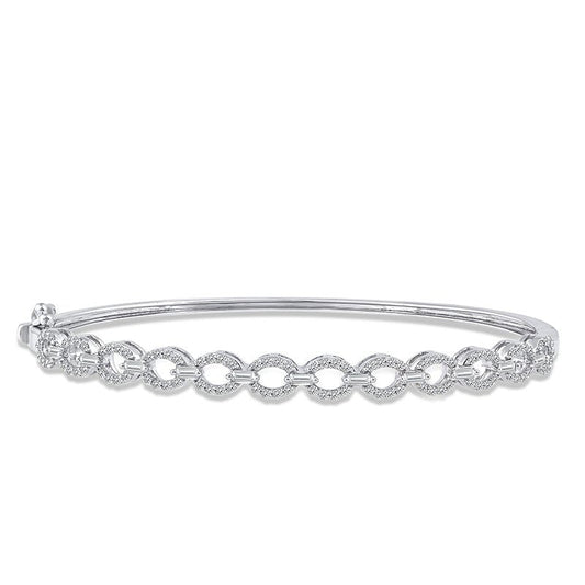 Yellow gold bangle with diamond accents.
