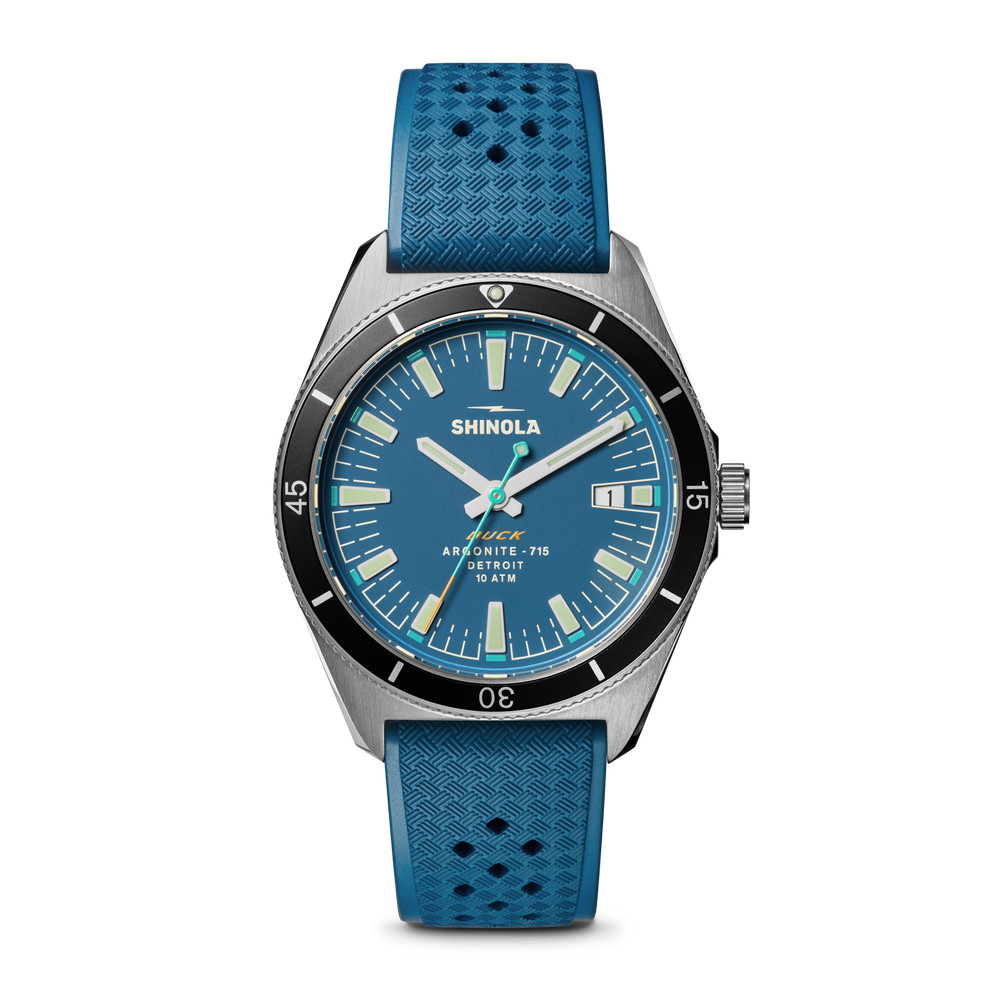 Blue dial watch with textured rubber strap.