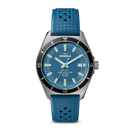 Blue dial watch with textured rubber strap.