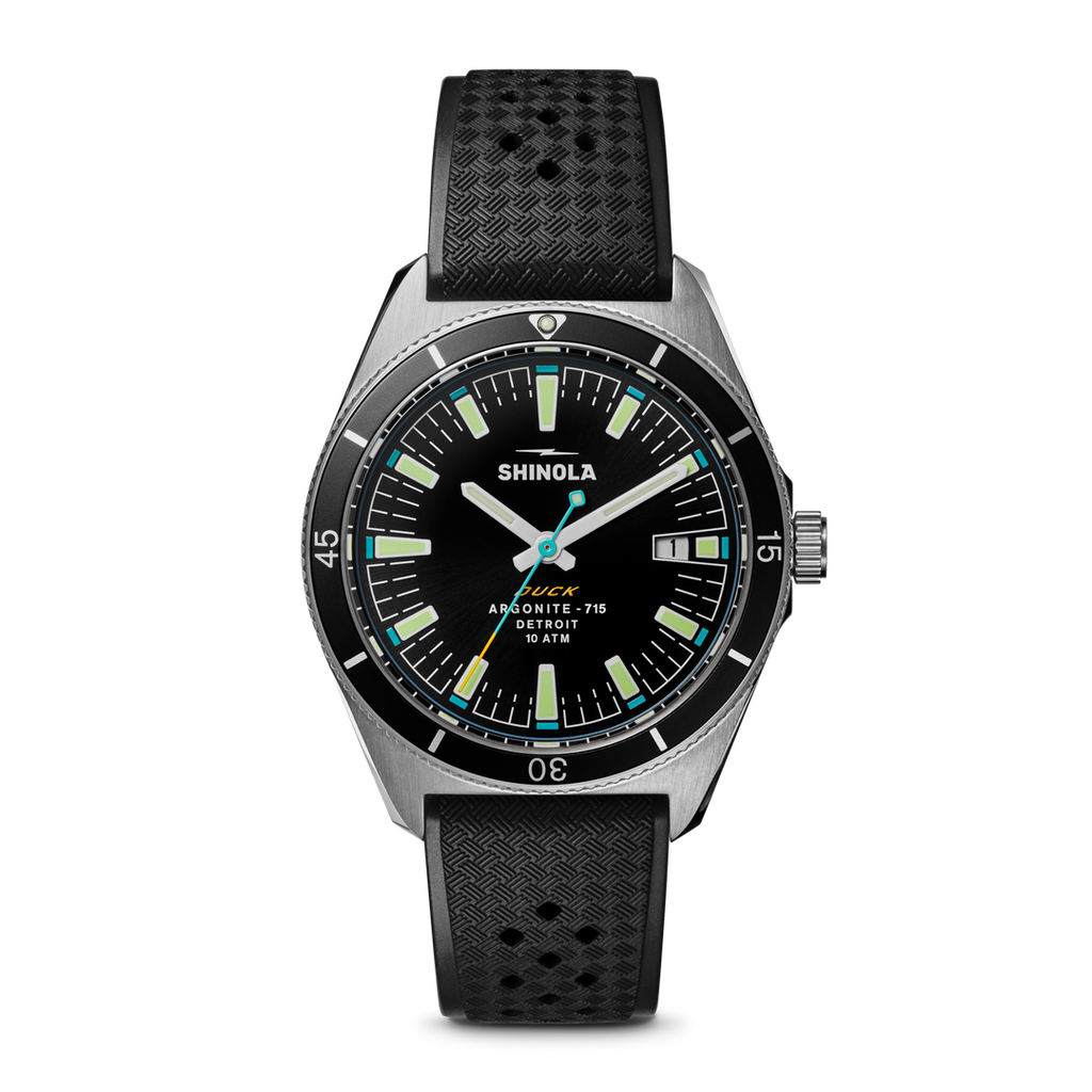 Black dial watch, stainless steel case, rubber strap.