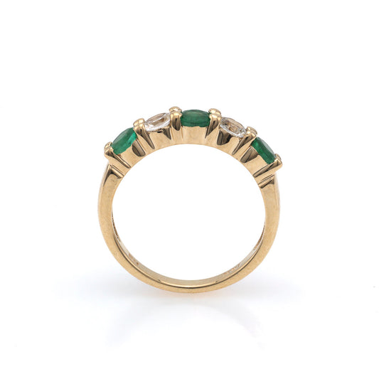 14K gold band with emeralds and sapphires.