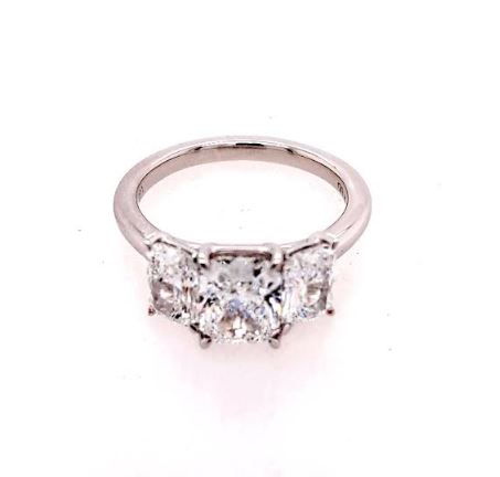 Three-stone white gold diamond engagement ring.