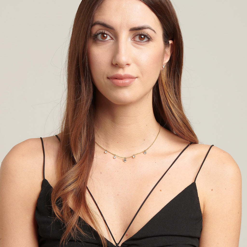 Yellow gold-tone simulated diamond pendant necklace.