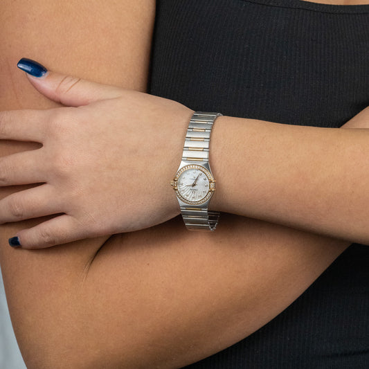 Stainless steel watch with diamond bezel.