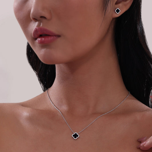 Clover onyx necklace with simulated diamonds.