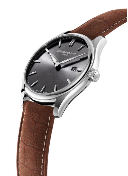Dark grey dial, brown leather strap watch.