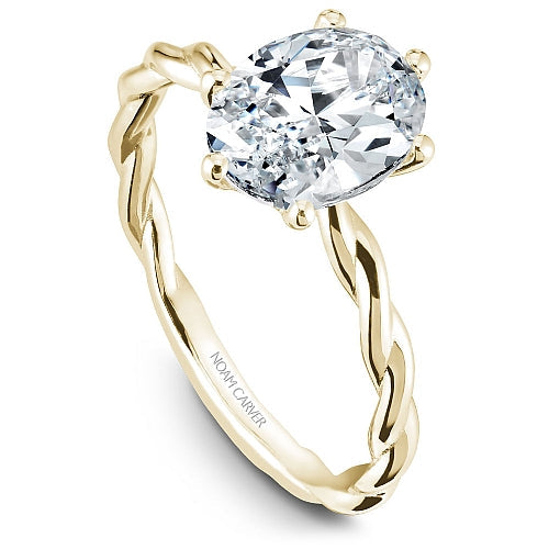 Twisted yellow gold band with diamond setting.