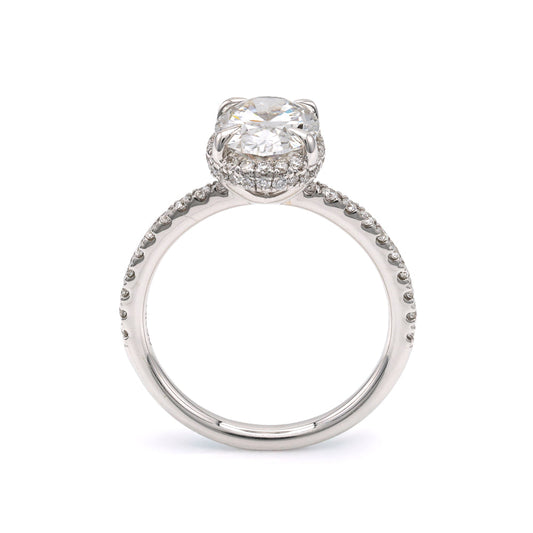 Halo engagement ring with oval diamond centerpiece.
