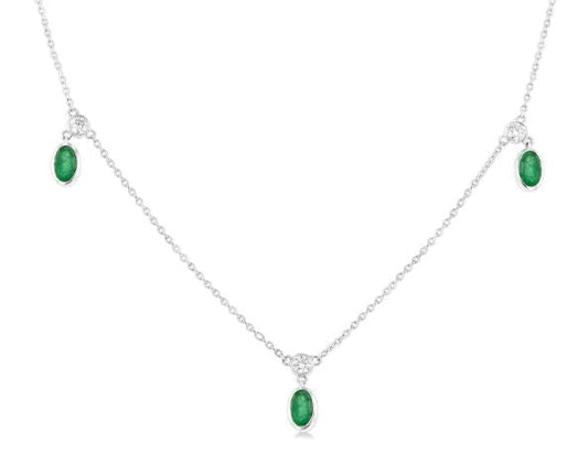 Oval emerald and diamond station necklace.