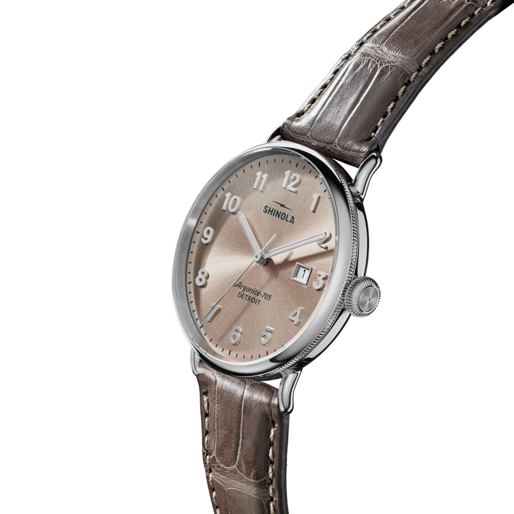 Champagne dial, stainless steel case, alligator band.