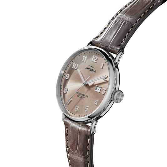 Champagne dial, stainless steel case, alligator band.