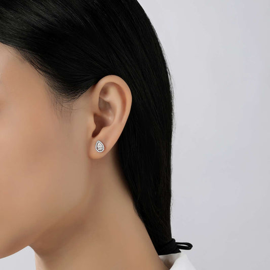 Teardrop platinum simulated diamond stud earrings.