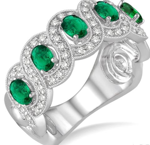 Oval emerald band with diamond accents.