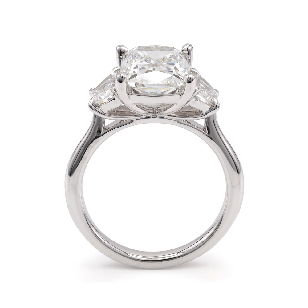 Three-stone white gold engagement ring.