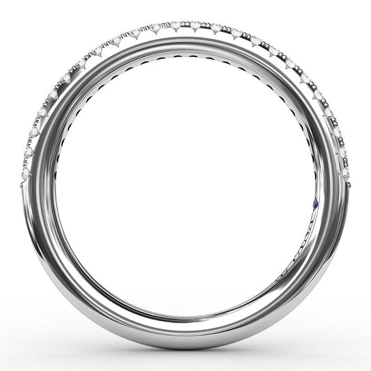 White gold band with diamonds and sapphire.