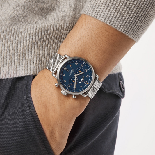 Stainless steel watch with blue dial.