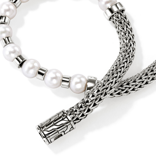 Sterling silver bracelet with cultured pearls.