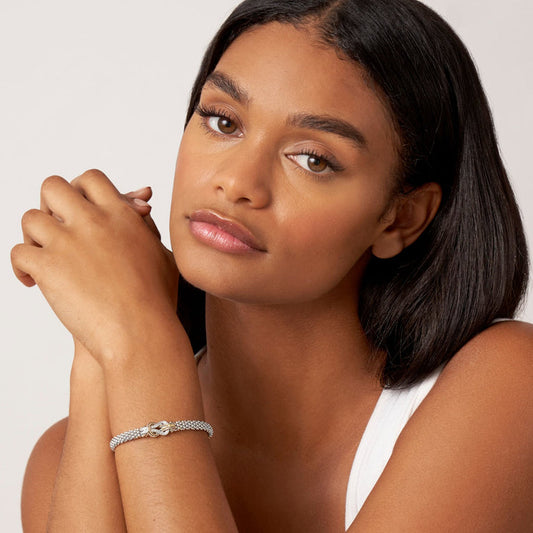 Sterling silver diamond bracelet with 18K gold accents.