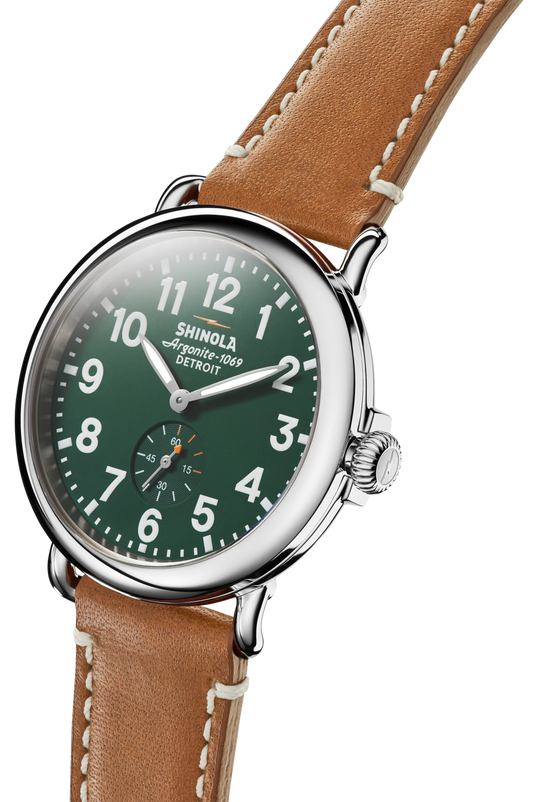 Green dial, stainless steel case, leather strap.