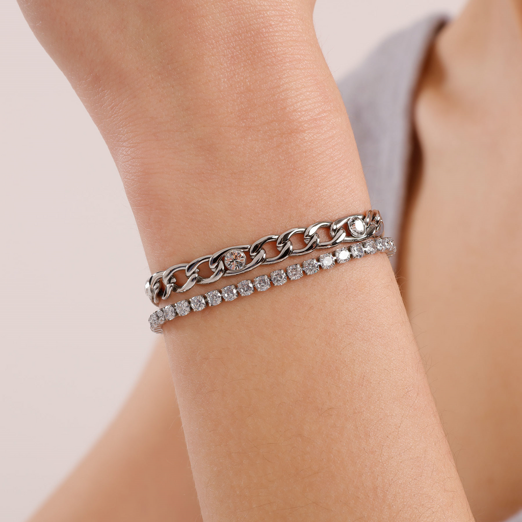 Multi-strand stainless steel bracelet with diamonds.