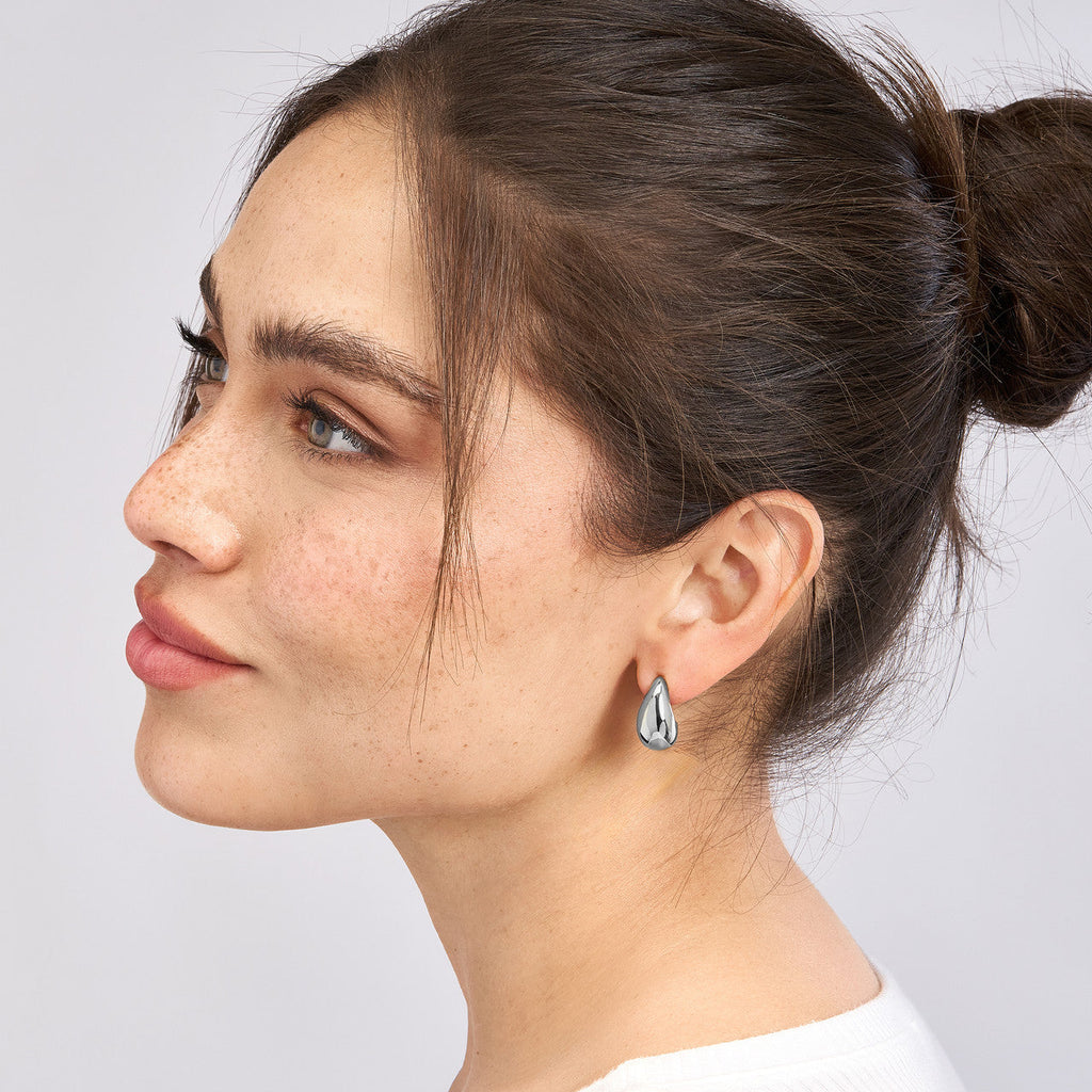 14K white gold teardrop earrings.