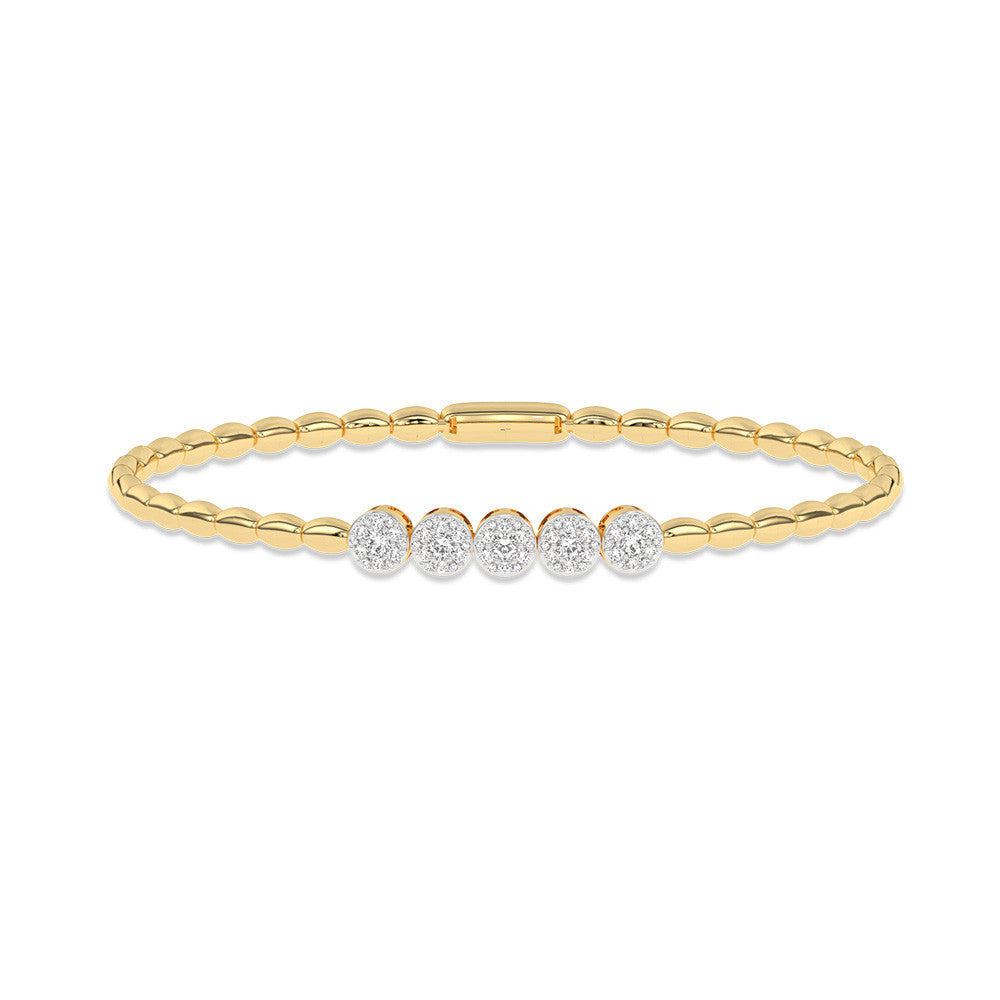 Yellow gold bracelet with diamond accents.
