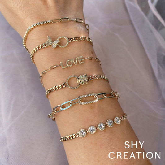 Yellow gold diamond station bracelet with lobster clasp.