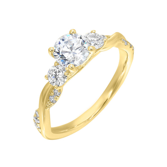 Three-stone diamond ring in yellow gold.