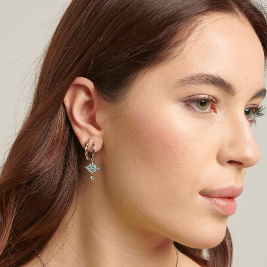 Stainless steel earrings with simulated diamond.