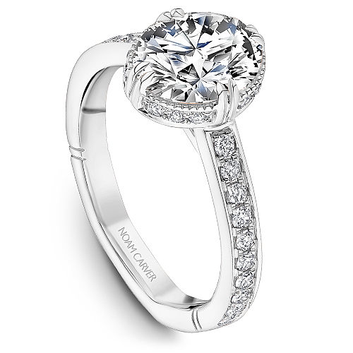 14K white gold diamond halo ring.
