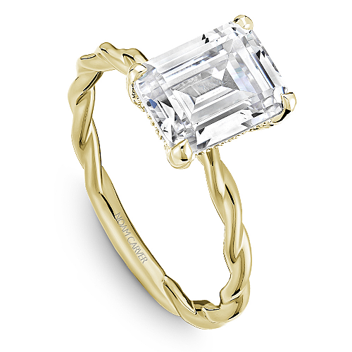 Yellow gold ring with large emerald-cut diamond.