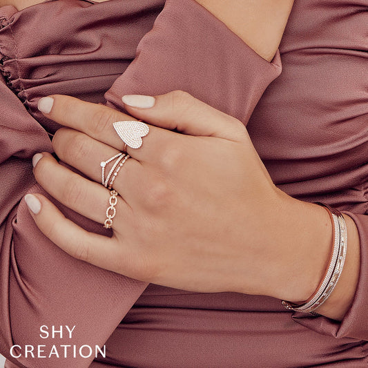 Rose gold diamond bracelet on wrist.