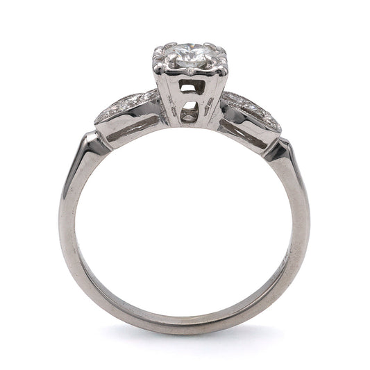 Vintage three-stone diamond ring in white gold.