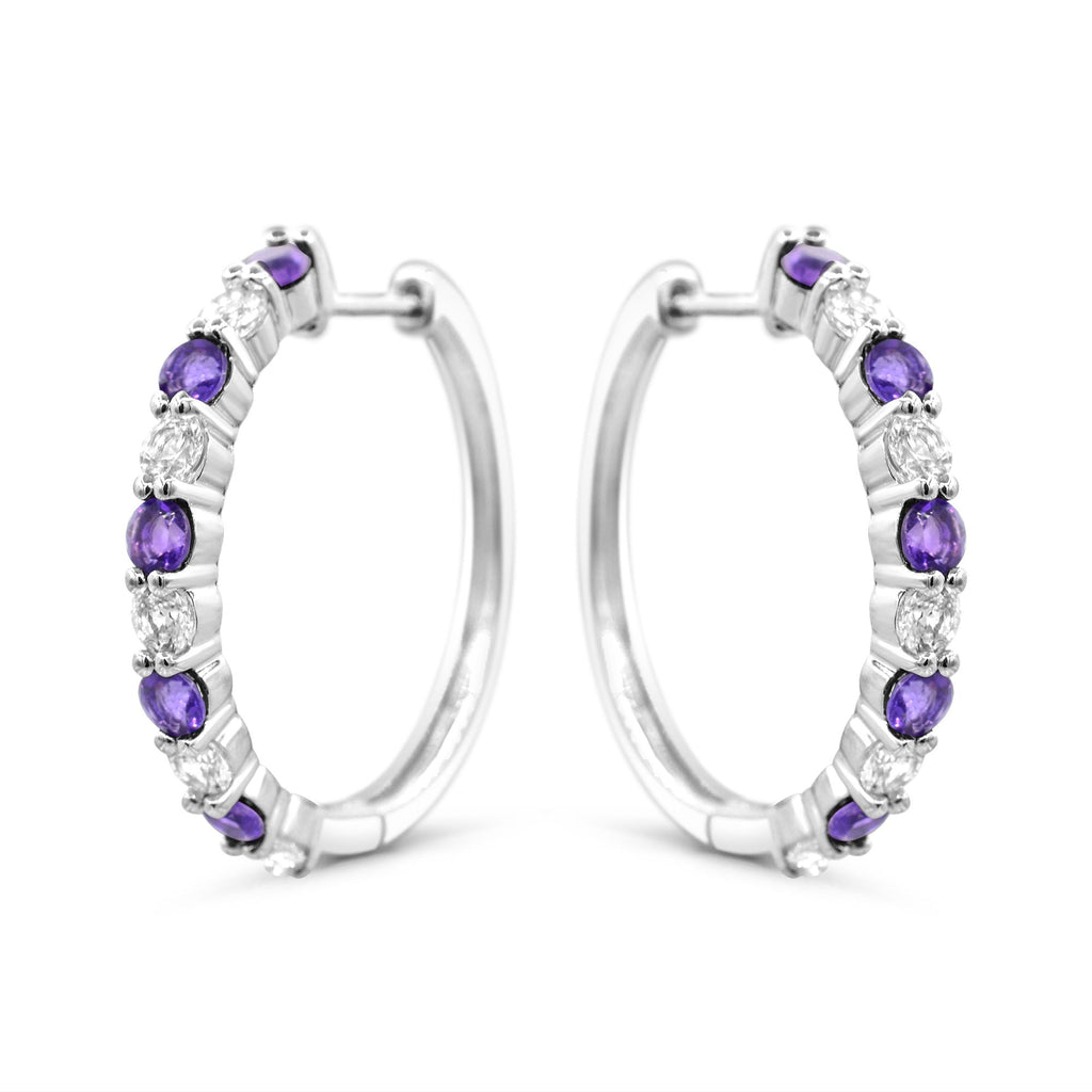 Sterling silver hoops with purple amethysts.