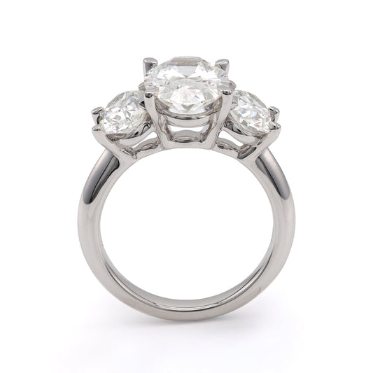 Three-stone white gold engagement ring.