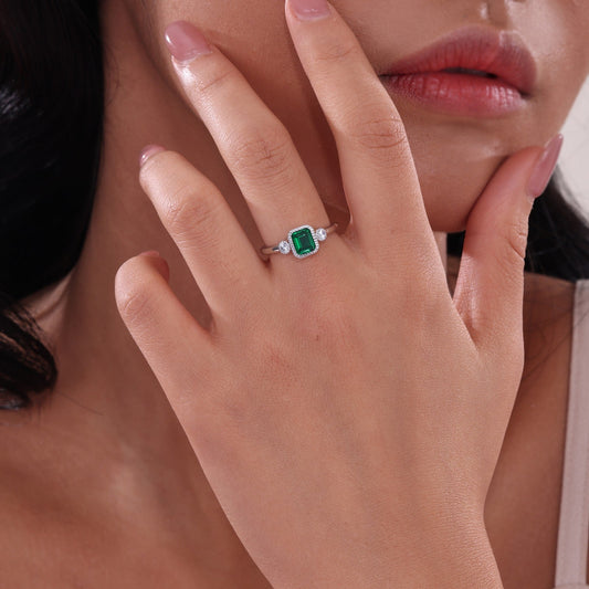 Simulated emerald ring with platinum band.