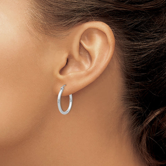14K white gold small hoop earrings.