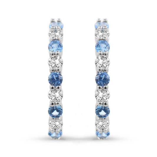 Sterling silver hoops with blue topaz stones.