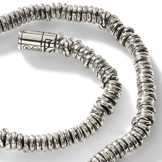 Sterling silver bead bracelet with hidden clasp.