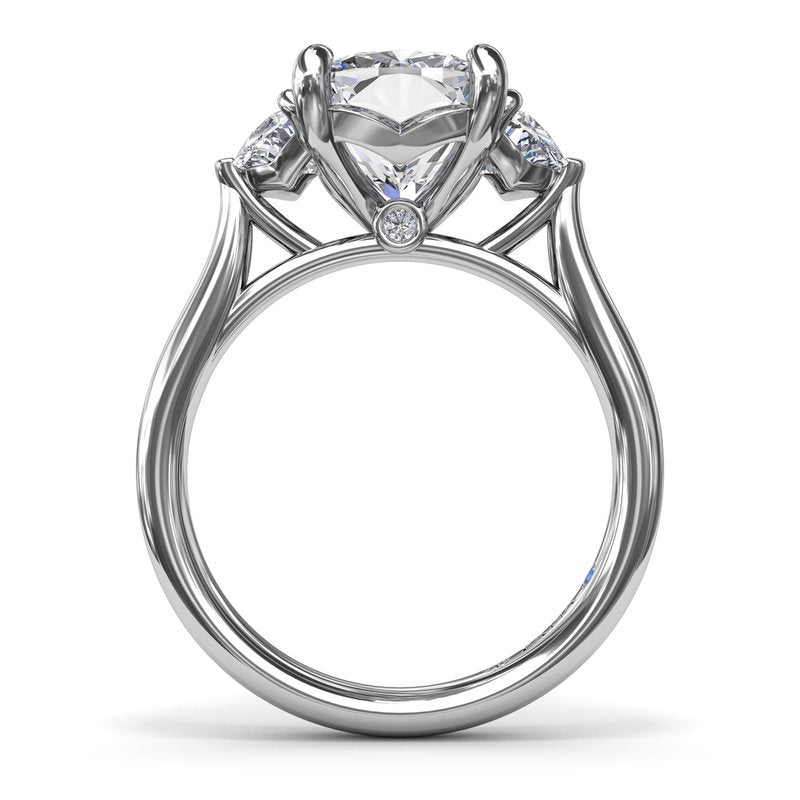 Three-stone diamond ring with half-moon accents.