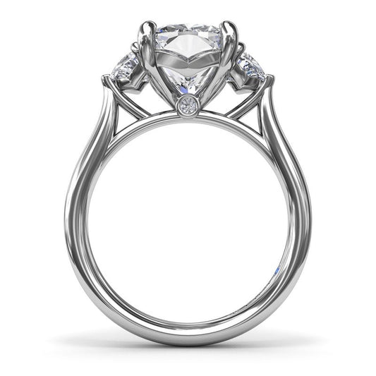 Three-stone diamond ring with half-moon accents.