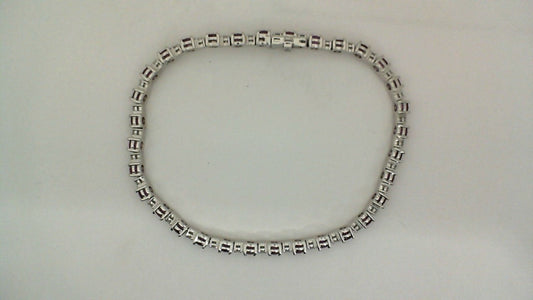 14K white bracelet with round rubies.