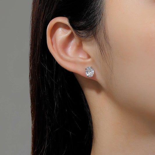 Oval simulated diamond earrings in platinum silver.