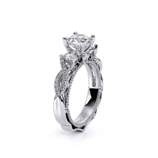 Three-stone diamond ring with intricate band design.