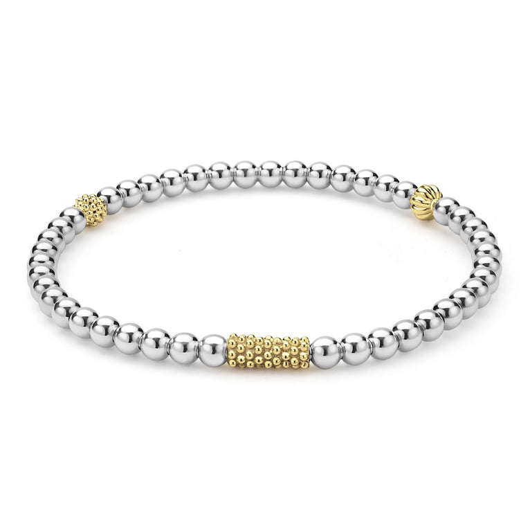 Sterling silver bracelet with gold accents.